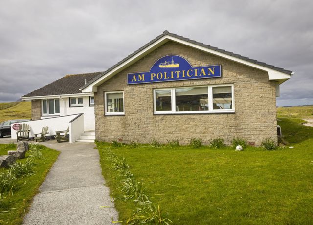 A view of the outside of the Politician Bar in Eriskay