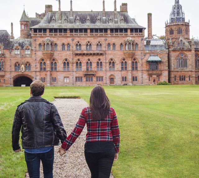 A couple walking up to Mount Stuart House