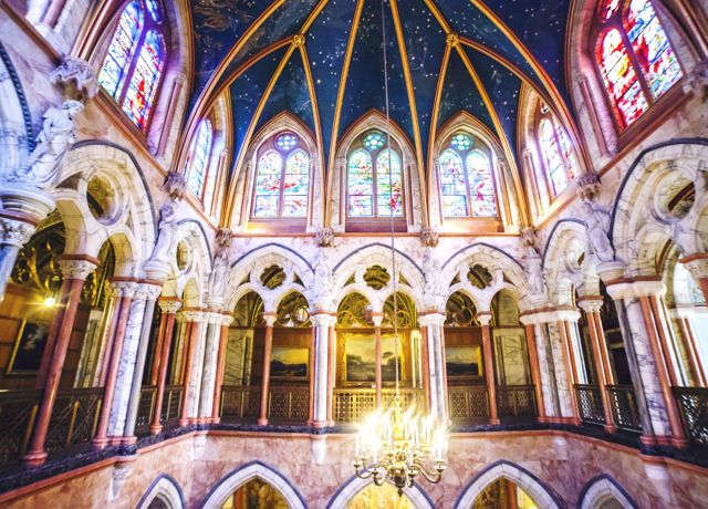 The arches and stained glass windows inside Mount Stuart 