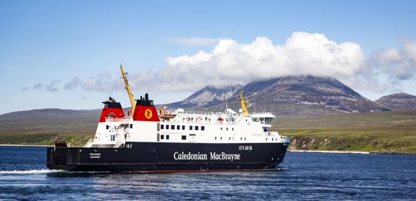 Caledonian MacBrayne ferry to and from Islay called MV Finlaggan, sailing with the cloud covered "Paps of Jura" in the background.