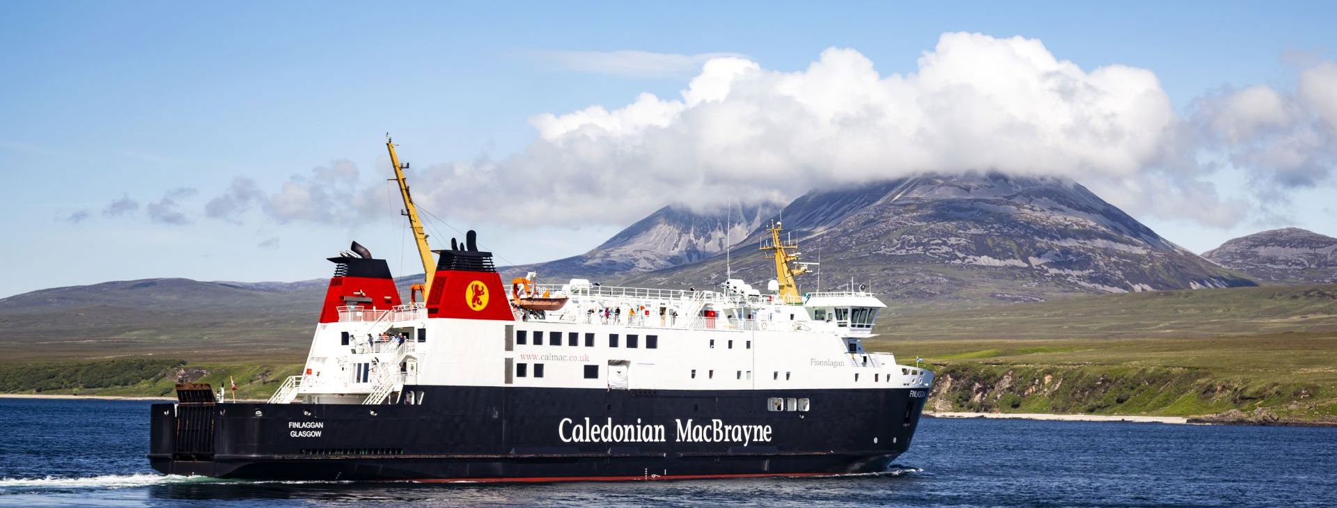 Caledonian MacBrayne ferry to and from Islay called MV Finlaggan, sailing with the cloud covered "Paps of Jura" in the background.