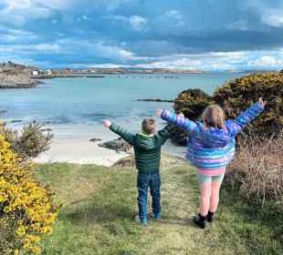 Children playing at a beach on Gigha