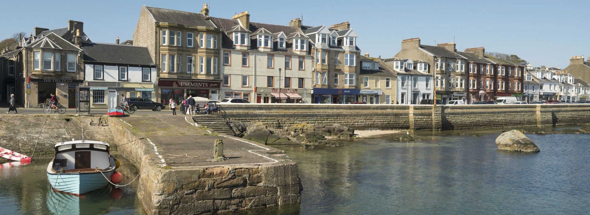 Millport promenade with shops, houses and seawall