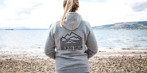 A female wearing a CalMac Black Cuillin Hoodie