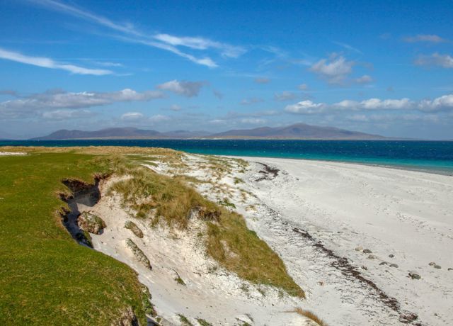 Isle of Berneray sandy beach under a blue sky