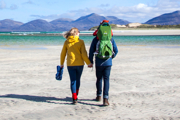 Family walking on a beach