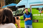 Hebridean Baker standing infront of an Arran Dairies van